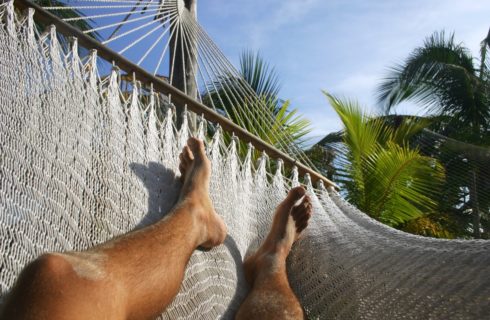 Person lounging in hammock