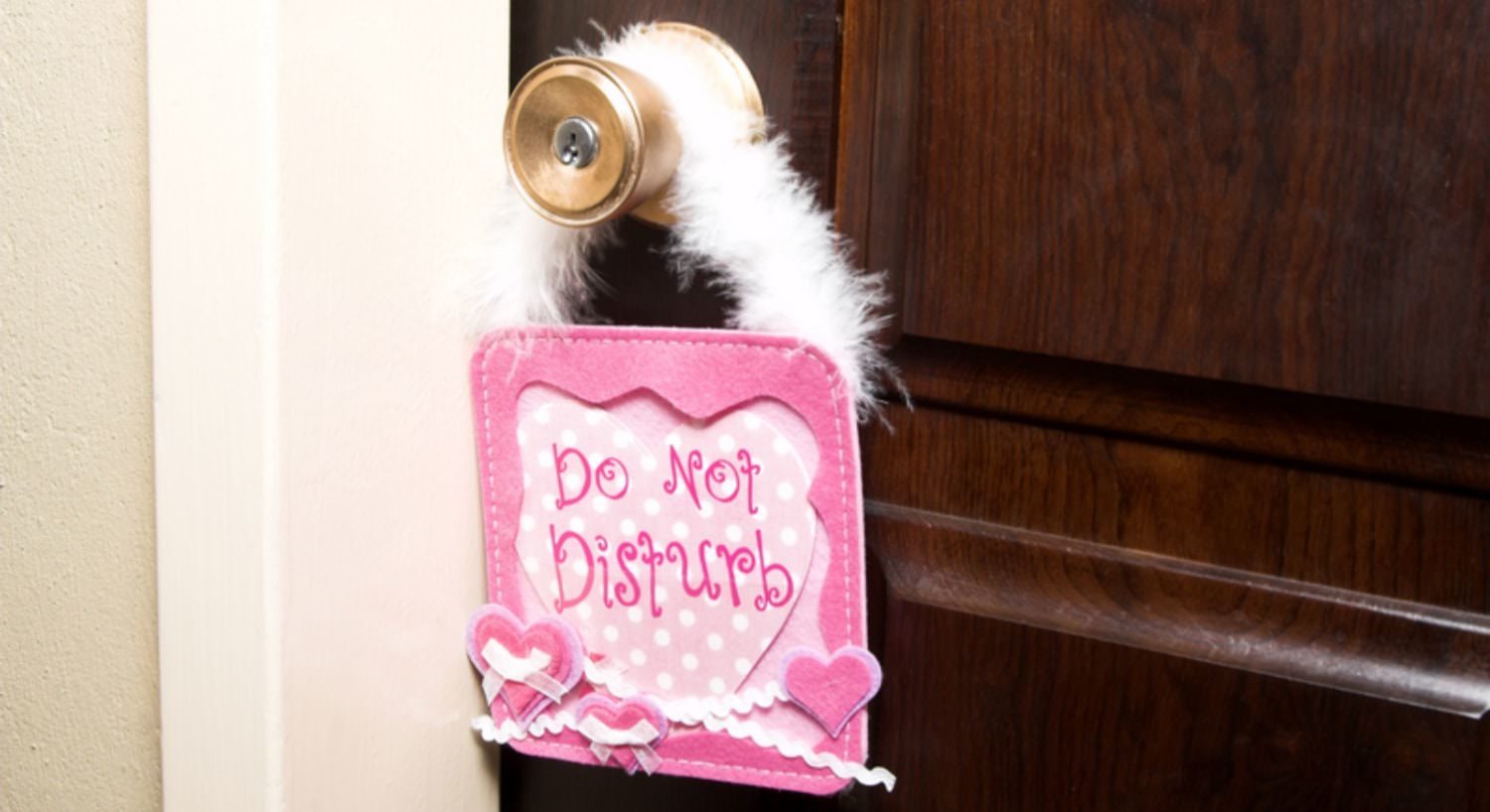 Pink door hanger with Do Not Disturb