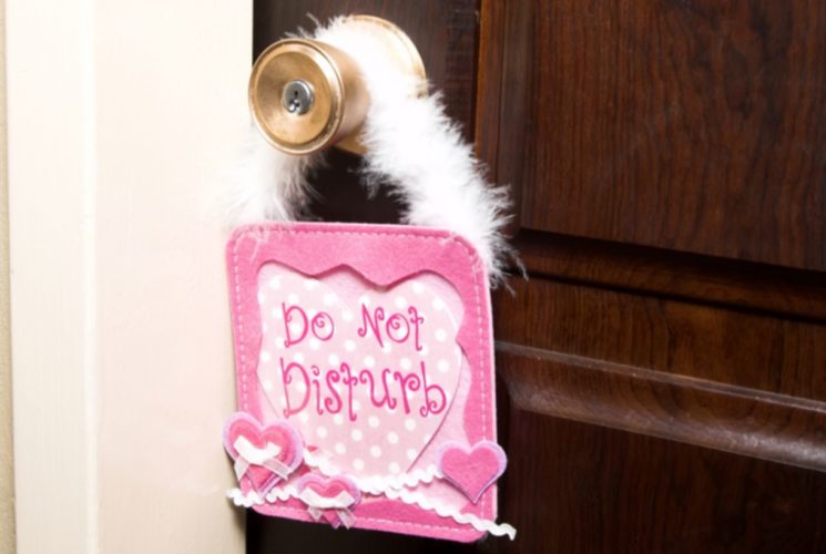 Pink door hanger with Do Not Disturb