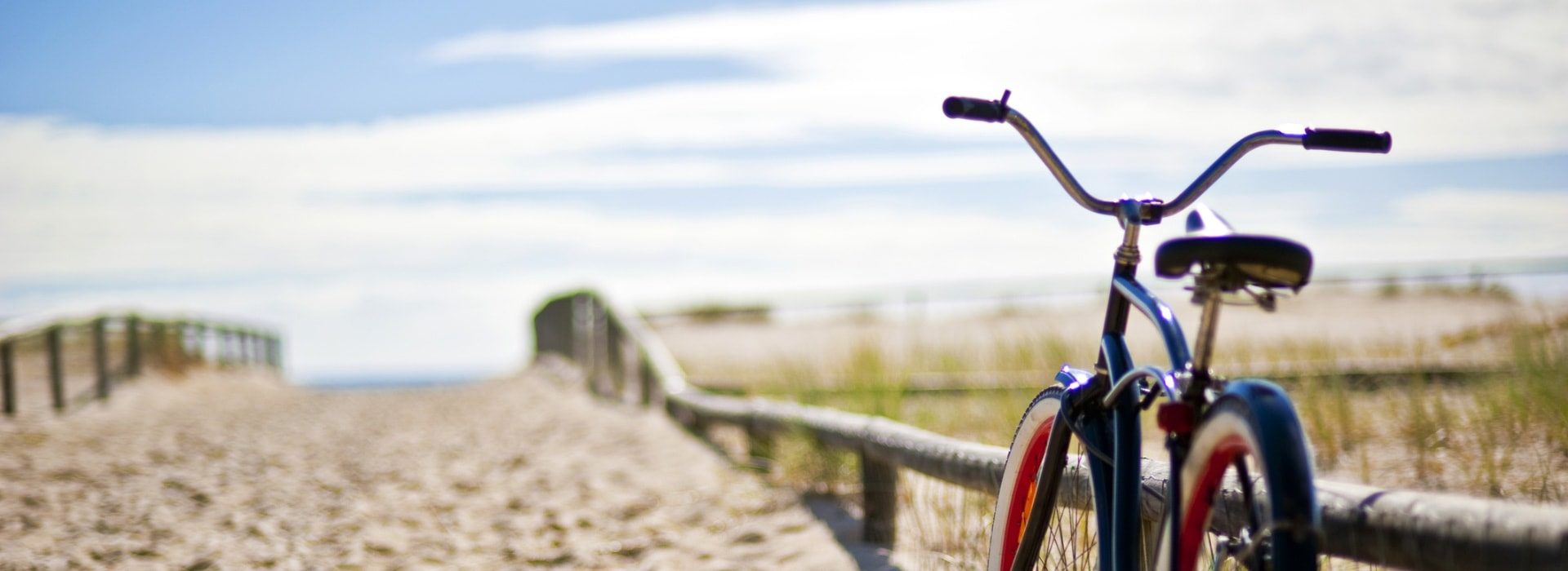 Bike near sandy path to beach