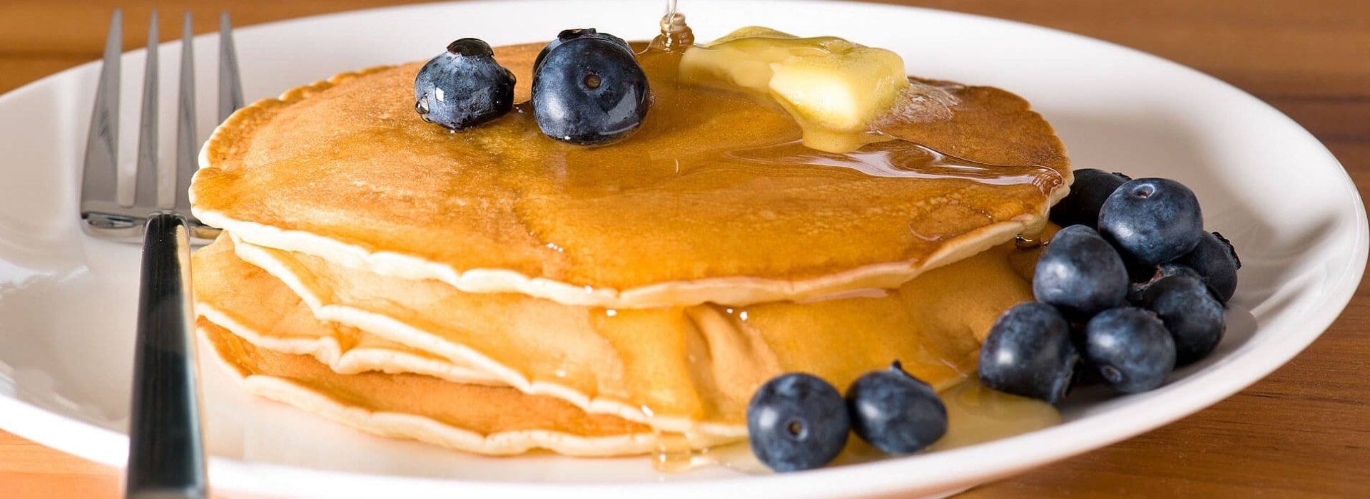 Close up view of pancakes with blueberries on top