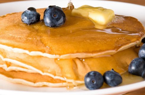 Close up view of pancakes with blueberries on top