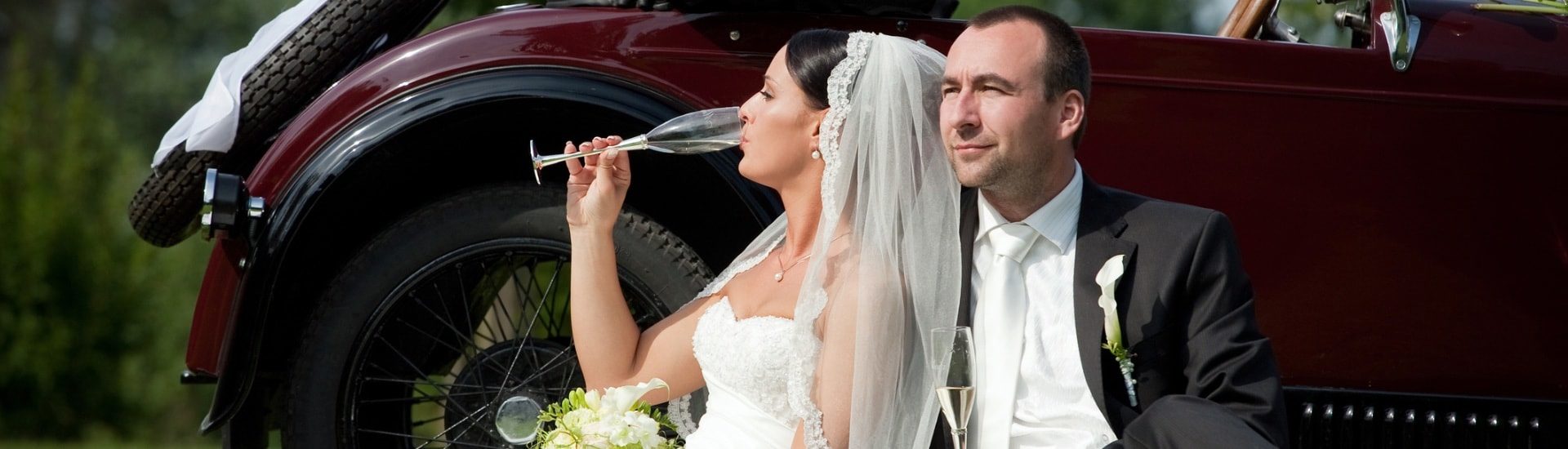 Bride and groom drinking champagne